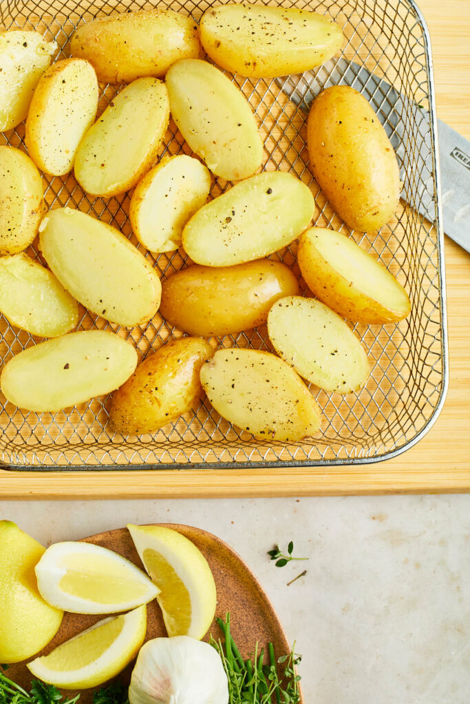 Potatoes on air fryer tray