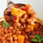 Slow Cooker Pineapple BBQ Baked Beans in ladle