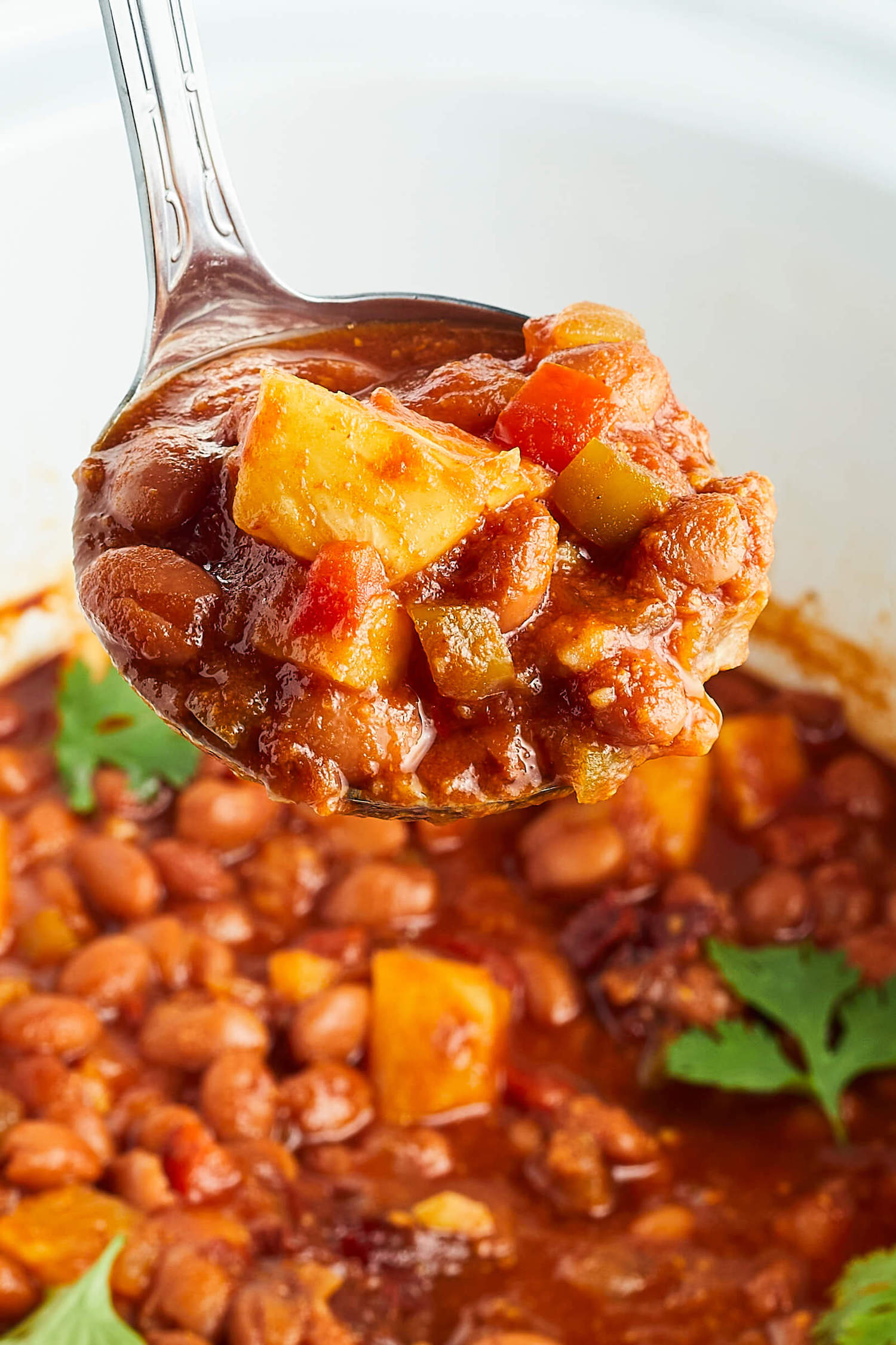 Slow Cooker Pineapple BBQ Baked Beans in ladle