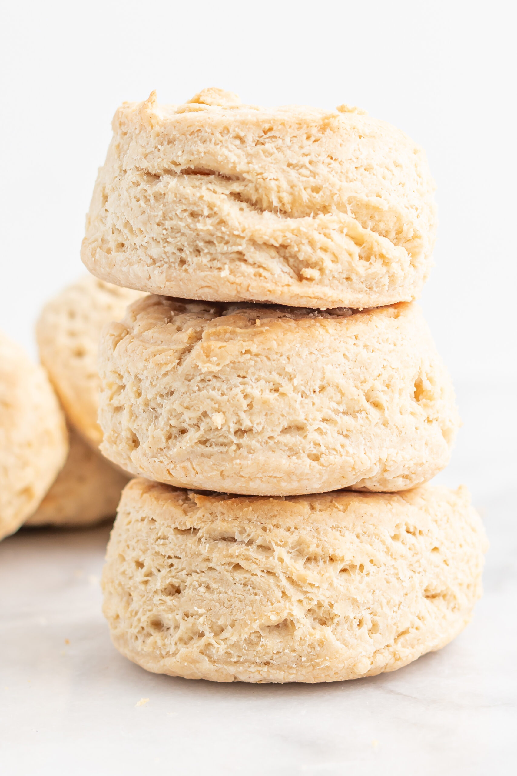 Three vegan biscuits stacked on marble background